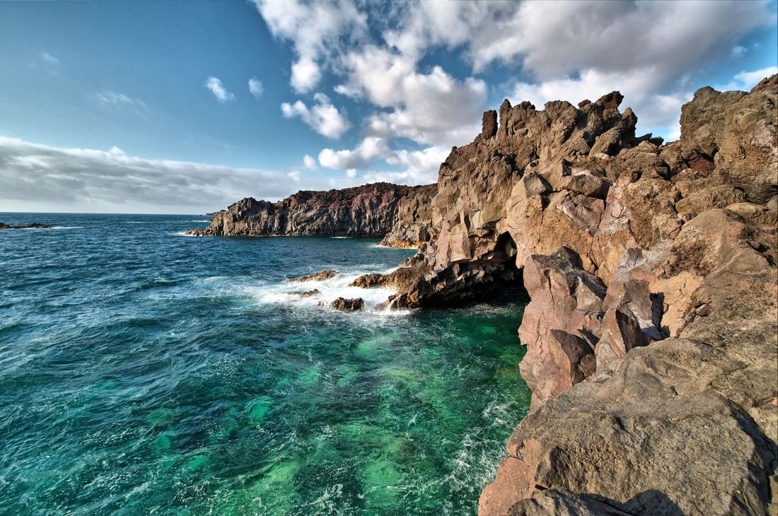 Turquoise Atlantic water against volcanic rocks on the Lanzarote coast