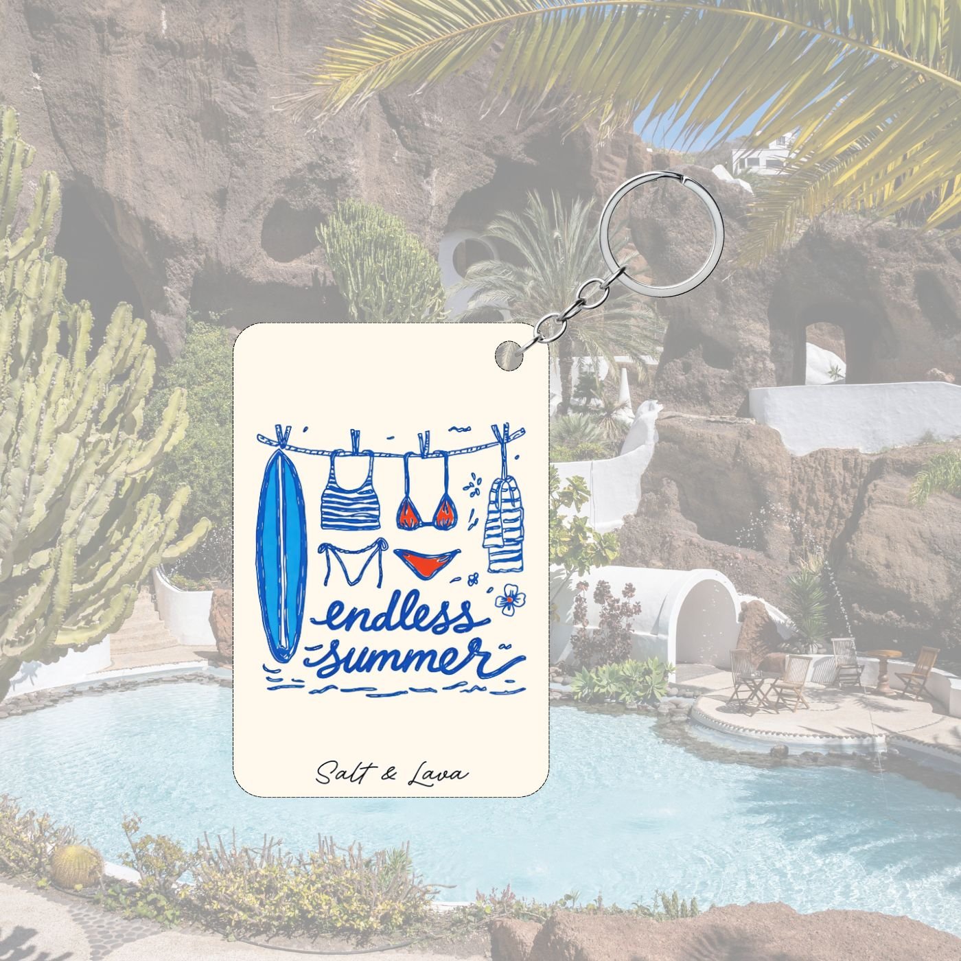 Cream keychain with a blue surfboard and swimwear on a washing line and the words endless summer